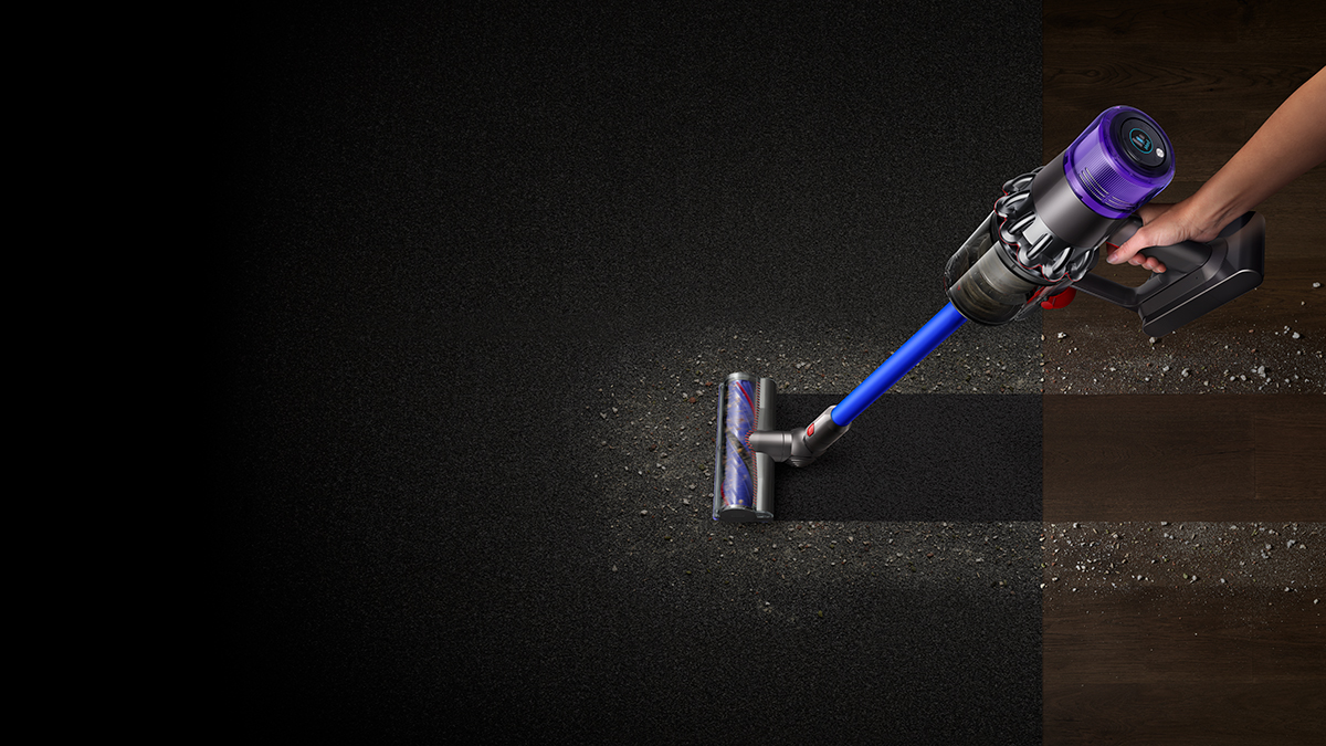 Vacuuming up a clean band across a very dusty carpet.